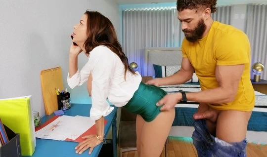 A bearded programmer in the office fucks a mom boss doggy style deep in her pussy